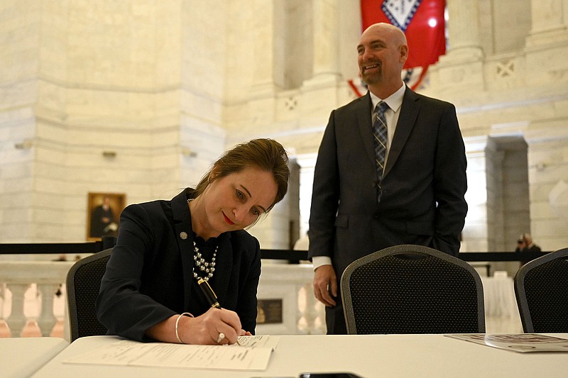 State Supreme Court Justice Rhonda Wood, with her husband, Dr. Michael Wood, files for reelection Wednesday at the state Capitol. Wood, who is unopposed, said she had planned to file Wednesday before the weather turned icy.
(Arkansas Democrat-Gazette/Stephen Swofford)