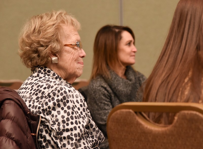 Ruth Ann Schnieders, at left, was recognized by her daughter, Ann Bax, during Thursday's first Women Doing Good sponsored by The Salvation Army and the News Tribune. Organizers recognized 20 local women for their commitment to community and the good they do for others in it. Seated in the background is Gina Clement of Capital City CASA, one of the women recognized at the event. (Julie Smith/News Tribune)