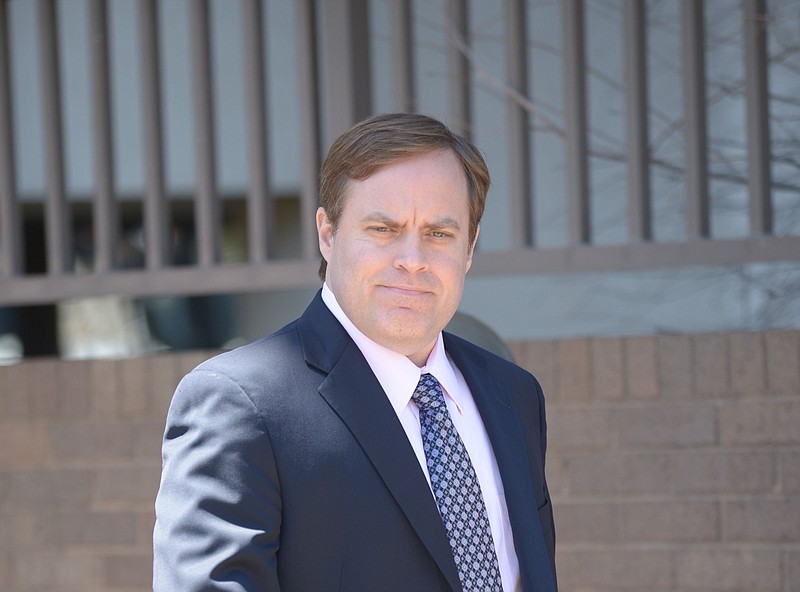 Former state Sen. Jon Woods walks outside the John Paul Hammerschmidt Federal Building in Fayetteville in this April 27, 2018, file photo. (NWA Democrat-Gazette/Andy Shupe)