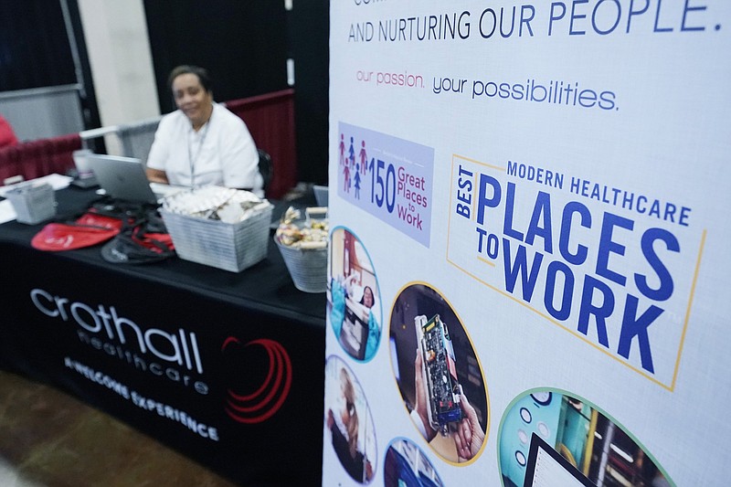 Employers manned booths with banners promoting their companies benefits, free logo branded swag and listed salary pay scales and in some cases recruitment bonuses in order to entice job applicants to approach their booths during the Lee County Area Job Fair in Tupelo, Miss., in October.
(AP)