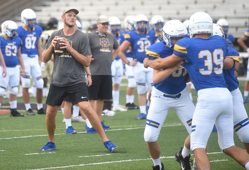 Mountain Home offensive coordinator Ryan Mallett throws passes during a warm-up for a scrimmage against Jonesboro in August 2021. 
(The Baxter Bulletin/Neal Denton)