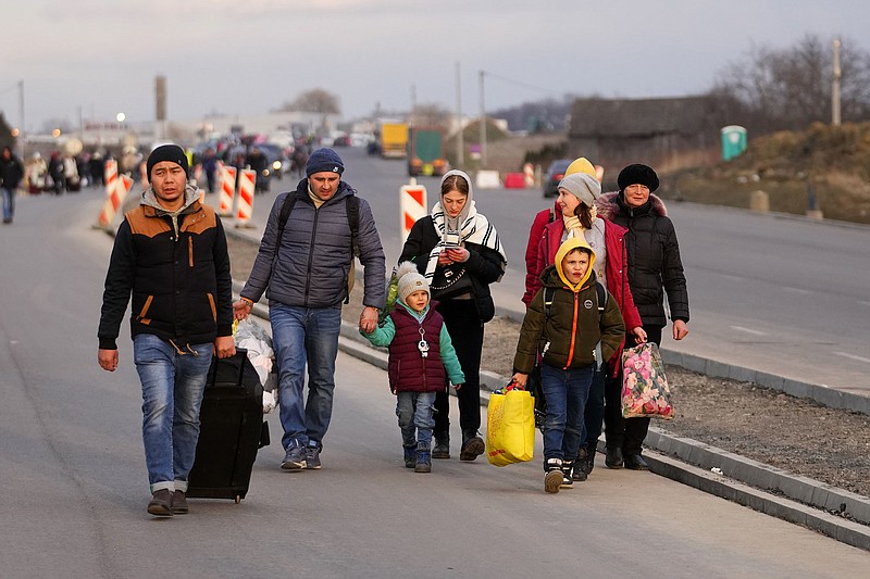 Refugees from Ukraine arrive Saturday in Przemysl, Poland.
(AP/Petr David Josek)