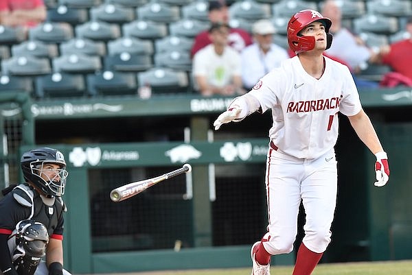 Arkansas right fielder Brady Slavens (17) watches a home run during the fourth inning of a game against Nebraska-Omaha on Wednesday, March 2, 2022, in Fayetteville.