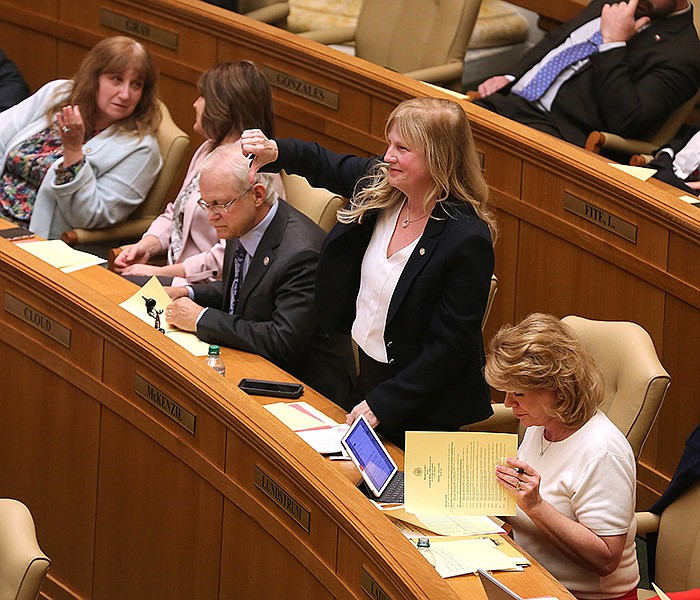 Rep. Gayla McKenzie, R-Gravette, motions to speak against SB102, for disbursing $1 million to pregnancy research centers, during the House session on Thursday at the state Capitol in Little Rock.
(Arkansas Democrat-Gazette/Thomas Metthe)