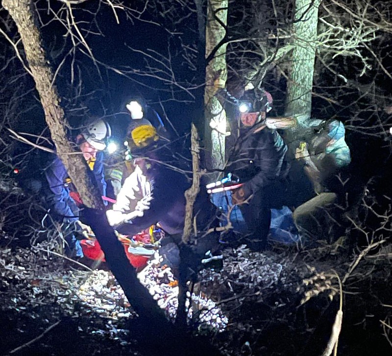 Search and rescue personnell assist a man who had fallen down a steep embankment Wedneday March 3, 2022 in Washington County. (Courtesy photo/GOSHEN ARKANSAS FIRE DEPARTMENT)
