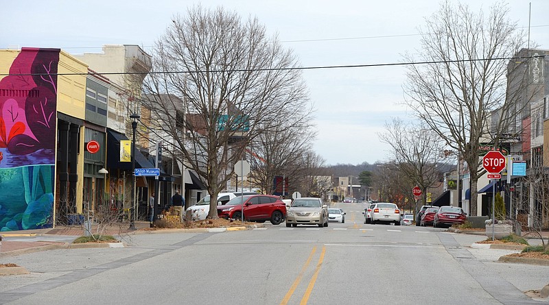 Traffic passes on Emma Avenue in downtown Springdale in this Jan. 14, 2022, file photo. (NWA Democrat-Gazette/Andy Shupe)