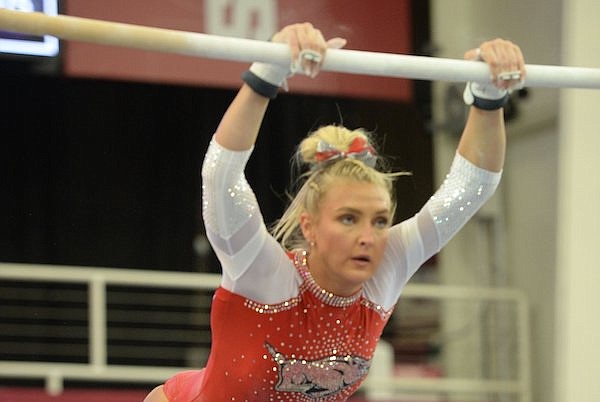 Arkansas' Sarah Shaffer competes Friday, Jan. 7, 2022, in the bars portion of the Razorbacks' match with Ohio State in Barnhill Arena in Fayetteville.