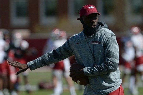 Arkansas assistant coach Jimmy Smith speaks to his position group on Thursday, April 8, 2021, during practice at the university practice facility in Fayetteville. Visit nwaonline.com/210409Daily/ for the photo gallery.