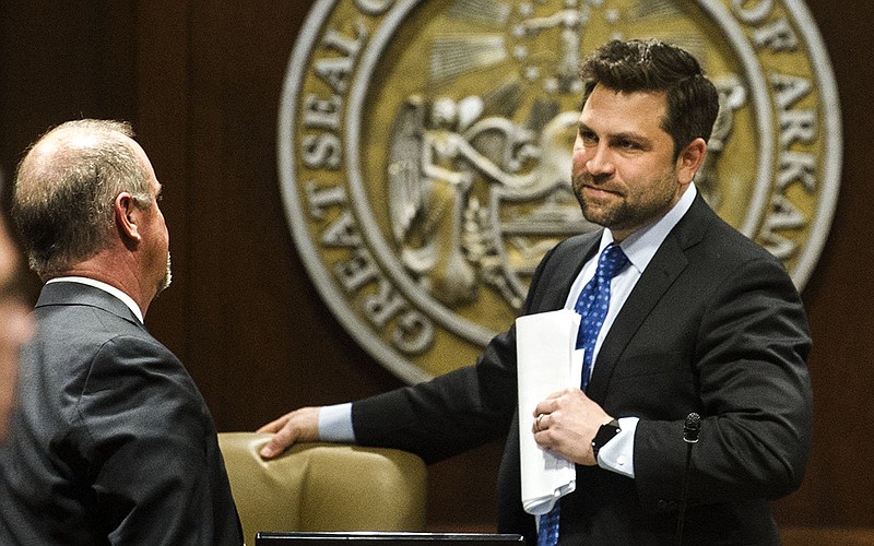 Senator Jonathan Dismang, R, talks with other members of the Joint Budget Committee after a meeting at the Arkansas State Capitol on Monday, March 7, 2022...(Arkansas Democrat-Gazette/Stephen Swofford)