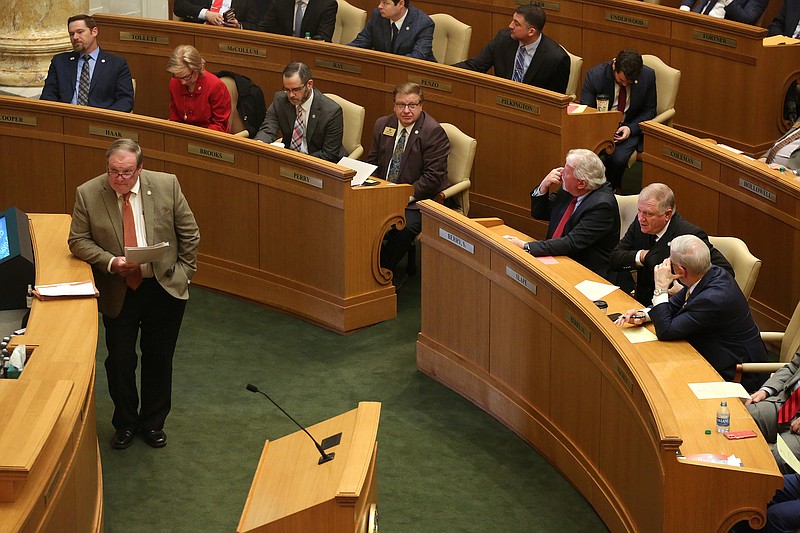 Rep. Lane Jean (left), R-Magnolia, waits for a vote on budget bills during the House session on Tuesday, March 8, 2022, at the state Capitol in Little Rock. .More photos at www.arkansasonline.com/39lege/.(Arkansas Democrat-Gazette/Thomas Metthe)