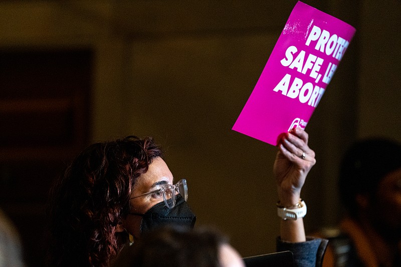 Catherine Betz holds up a sign Wednesday during a Pro-Choice Missouri rally at the Capitol. (Ethan Weston/News Tribune)