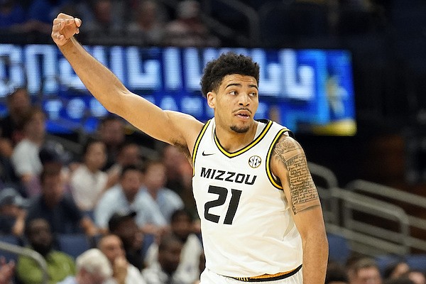 Missouri forward Ronnie DeGray III (21) celebrates after making a three-point basket during the first half of an NCAA men's college basketball Southeastern Conference tournament game against Ole Miss on Wednesday, March 9, 2022, in Tampa, Fla. (AP Photo/Chris O'Meara)
