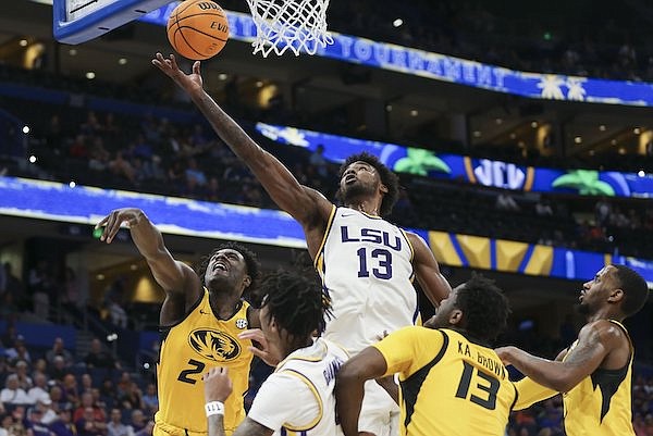 LSU forward Tari Eason (13) goes up for a shot during an SEC Tournament game against Missouri on Thursday, March 10, 2022, in Tampa, Fla.