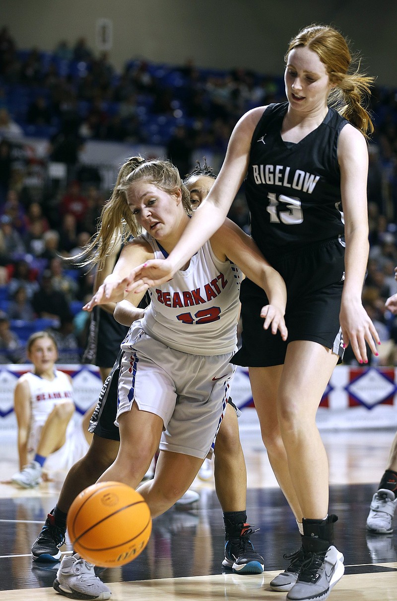 Melbourne’s Halle Skidmore (left) steals the ball from Bigelow’s Jenna Starks on Friday during the second quarter of a 63-30 victory in the Class 2A girls state championship game at Bank OZK Arena in Hot Springs. More photos at arkansasonline.com/312girls2a/.
(Arkansas Democrat-Gazette/Thomas Metthe)