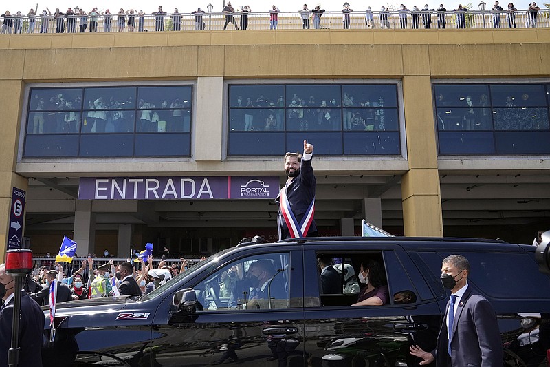 New Chilean President Gabriel Boric parades through the street Friday in Valparaiso after being sworn in.
(AP/Natacha Pisarenko)