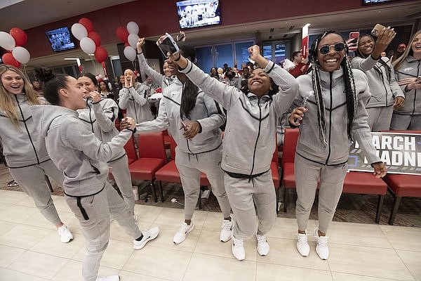 Arkansas players celebrate their selection to the NCAA Tournament during a watch party on Sunday, March 13, 2022, in Fayetteville.