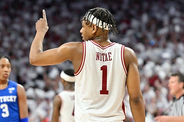 Arkansas guard JD Notae reacts after scoring against Kentucky during the second half of an NCAA college basketball game Saturday, Feb. 26, 2022, in Fayetteville, Ark. (AP Photo/Michael Woods)