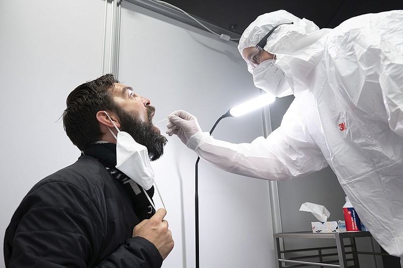 Danilo Schulz gets a coronavirus quick test Wednesday at the Johanniter Corona Test Center in the Palace of Culture in Dresden, Germany. Health Minister Karl Lauterbach has called the country’s surge in covid-19 cases critical.
(AP/dpa/Sebastian Kahnert)
