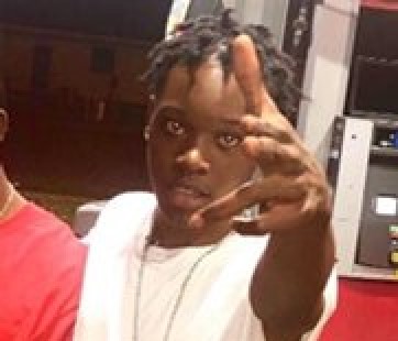 Suspect in slaying hears of 23 charges