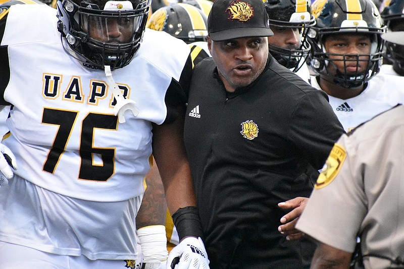 UAPB Coach Doc Gamble leads his team onto the field for a Sept. 18 game at the University of Central Arkansas. 
(Pine Bluff Commercial/I.C. Murrell)