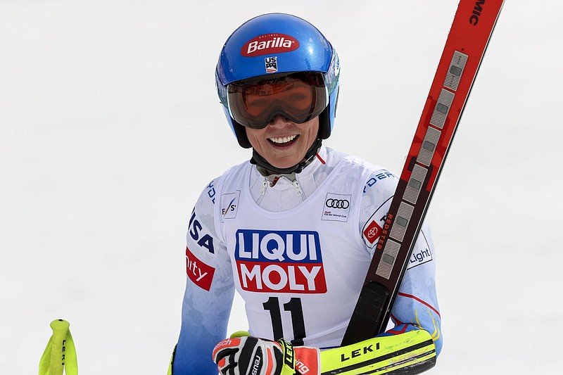 United States' Mikaela Shiffrin smiles after crossing the finish line of an alpine ski, women's World Cup Finals super-G, in Courchevel, France, Thursday, March 17, 2022. (AP Photo/Alessandro Trovati)