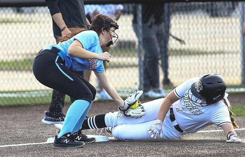 Trista Peterson (7) slides in safe for a triple against as Laney Emmert applies tag of Southside on Thursday, Match 17, 2022, Tiger Athletic Complex, Bentonville, Ark. Visit nwaonline.com/220317Daily/ for today's photo gallery..(Special to the NWA Democrat-Gazette/David Beach)