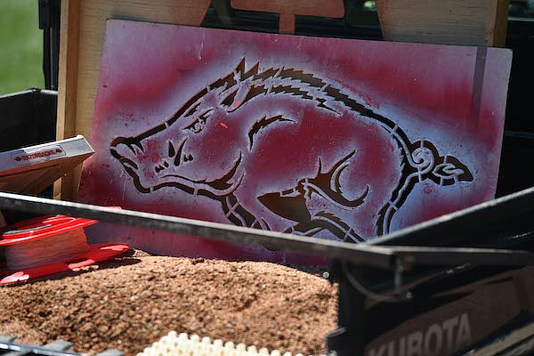 An Arkansas Razorbacks logo is shown on a stencil prior to a game against Illinois-Chicago on Saturday, March 12, 2022, in Fayetteville.
