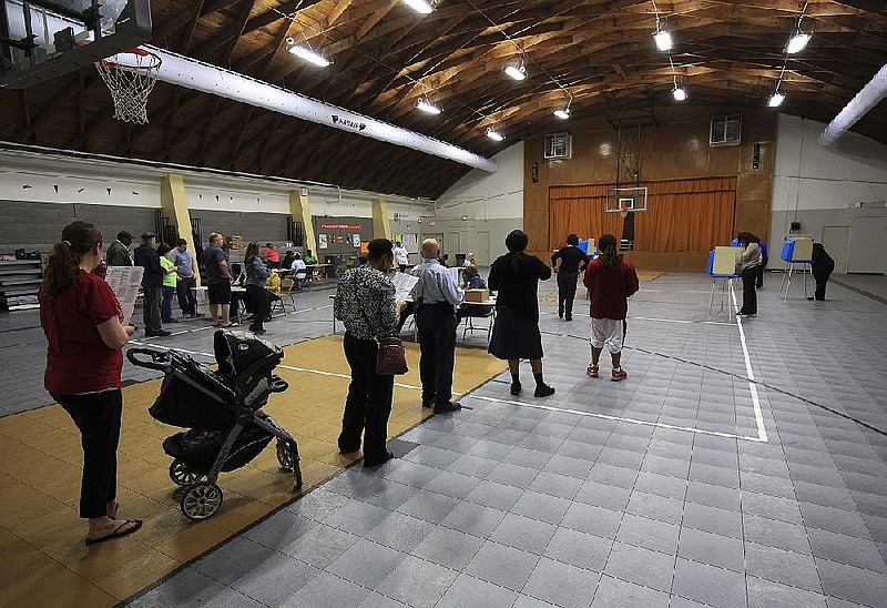 Voters wait for a voting booth in the gym at Harris Elementary School in North Little Rock in this Nov. 8, 2016, file photo. (Arkansas Democrat-Gazette/Staton Breidenthal)