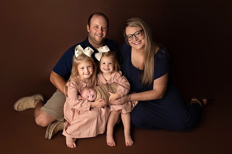 England football Coach Josh Anderson and his wife Ashlyn welcomed their third child, Brooks (center), during the 2021 football season. Brooks was diagnosed with a rare form of cancer 11 days after he was born as the community rallied for support. The Andersons also have two daughters, Marleigh (left) and Amelia.
(Photo courtesy Josh Anderson)