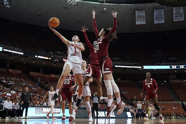 Utah guard Isabel Palmer (1) drives to the basket against Arkansas guard Makayla Daniels (43) during the first half of a college basketball game in the first round of the NCAA women's tournament, Friday, March 18, 2022, in Austin, Texas. (AP Photo/Eric Gay)