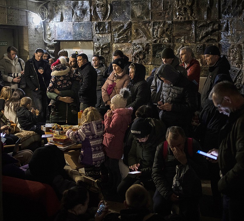 People gather in a basement Saturday during an air raid in Lviv, Ukraine. Lviv has been a refuge since the war began nearly a month ago, hosting hundreds of thousands of Ukrainians who fled the fighting in other areas of the country. More photos at arkansasonline.com/ukraineimages/.
(AP/Bernat Armangue)