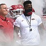 Arkansas strength coach Jamil Walker (right) stands next to head football coach Sam Pittman prior to a game against Rice on Saturday, Sept. 4, 2021, in Fayetteville.