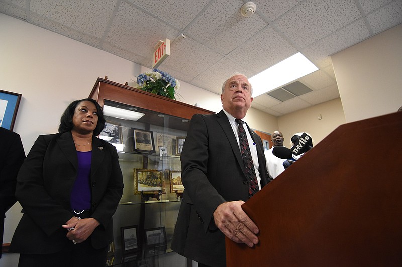 Arkansas State Police Director Bill Bryant (at podium) answers questions from the media during a press conference Sunday, March 20, 2022, at the Southeast Arkansas Law Enforcement Center in Dumas. (Arkansas Democrat-Gazette/Staci Vandagriff)