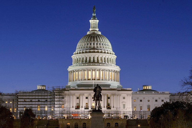 FILE - The U.S. Capitol building is seen before sunrise on Capitol Hill in Washington, Monday, March. 21, 2022. (AP/Gemunu Amarasinghe, File)