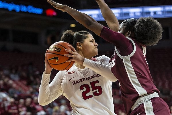 Arkansas' Destinee Oberg (25) looks to pass during a game against Arkansas-Little Rock on Sunday, Dec. 12, 2021, in Fayetteville.