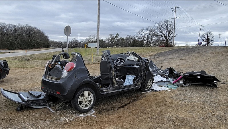 A destroyed vehicle sits near a road in Tishomingo, Okla., after the Tuesday collision that killed six teenage students.
(AP/NewsNation KFOR)