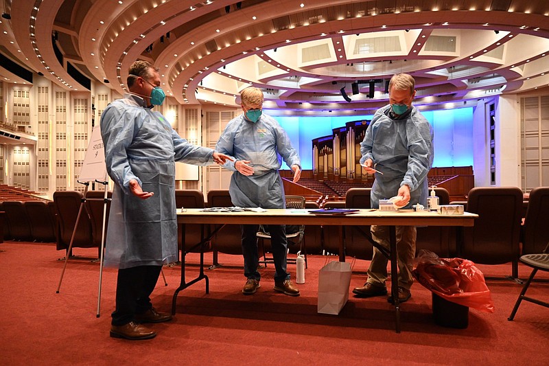 Health care workers prepare to administer COVID-19 tests on members of the Tabernacle Choir and members of the media on Tuesday, September 21, 2021, in the Conference Center in Salt Lake City, Utah, leading up to the iconic Latter-day Saint music group?s first in-person rehearsal since the beginning of the pandemic. Courtesy of the Church of Jesus Christ of Latter-day Saints.