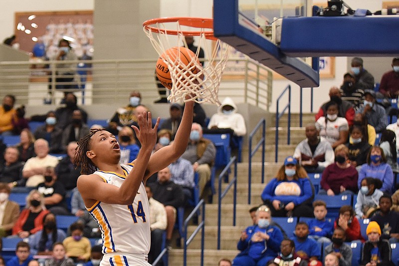 North Little Rock?s Nick Smith scores a basket during the first half of Friday night?s game against Bryant at Charging Wildcat Arena in North Little Rock. See more photos at arkansasonline.com/218nlrbryant/..(Arkansas Democrat-Gazette/Staci Vandagriff)