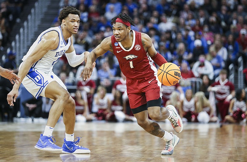 Arkansas guard JD Notae (1) drives the ball past Duke forward Paolo Banchero (5), Saturday, March 26, 2022 during the first half of the Elite 8 round of the 2022 NCAA Division 1 Men's Basketball Championship at Chase Center in San Francisco, Calif. Check out nwaonline.com/220327Daily/ and nwadg.com/photos for a photo gallery...(NWA Democrat-Gazette/Charlie Kaijo)