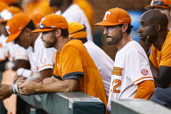 Tennessee head coach Tony Vitello, front right, looks on during an NCAA college baseball super regional game against LSU, Saturday, June 12, 2021, in Knoxville, Tenn. (AP Photo/Wade Payne)