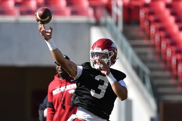 Arkansas quarterback Lucas Coley throws Tuesday, March 15, 2022, during practice at Razorback Stadium in Fayetteville.