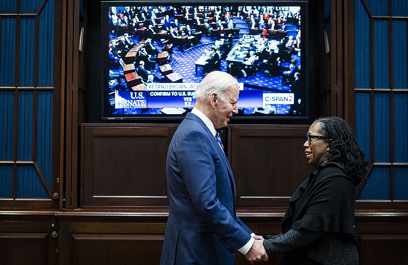 President Joe Biden celebrates with Judge Ketanji Brown Jackson on Thursday at the White House as they watch the Senate votes to confirm Jackson to the Supreme Court.
(The New York Times/Al Drago)