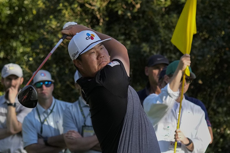 Sungjae Im of South Korea tees off on the 15th hole Thursday at the Masters in Augusta, Ga. He fired a 5-under 67 to take the first-round lead. More photos at arkansasonline.com/48masters22/.
(AP/Charlie Riedel)