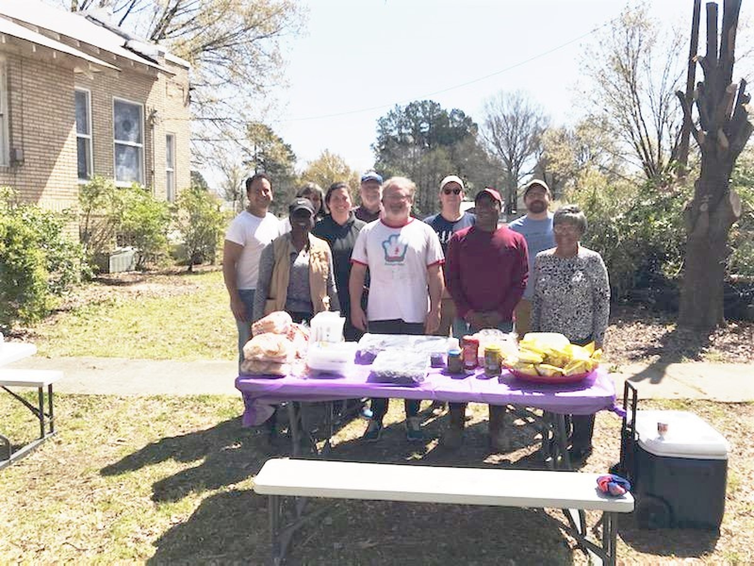 Helpers pitch in at site of church