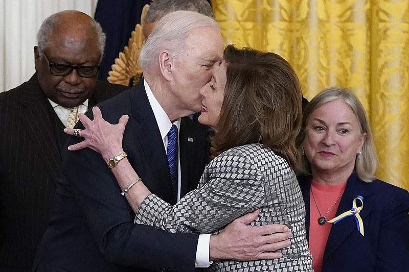 President Joe Biden kisses House Speaker Nancy Pelosi during a Patient Protection and Affordable Care Act event Tuesday at the White House. Pelosi announced Thursday that she had tested positive for the coronavirus.
(AP/Carolyn Kaster)