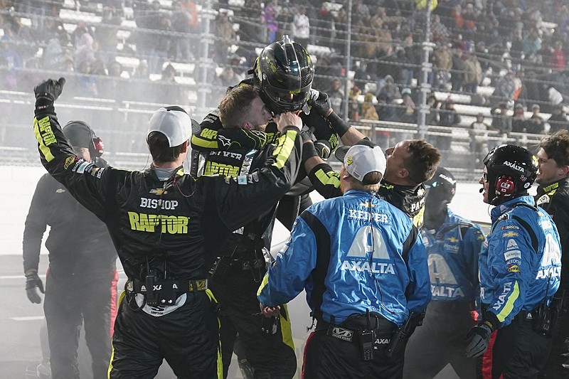 William Byron is swarmed by his pit crew after his NASCAR Cup Series victory at Martinsville Speedway on Saturday night in Martinsville, Va. Byron’s fast car allowed him to pull away on restarts, which contributed to the 24-year-old’s second Cup Series win this season.
(AP/Steve Helber)