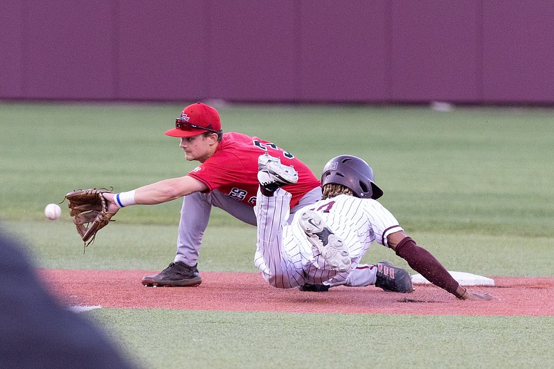 UALR’s Tyler Williams (right) steals second base ahead of the tag by Arkansas State second baseman Garrett Olson during Thursday night’s game at Gary Hogan Field in Little Rock. Arkansas State won 6-5. More photos available at arkansasonline.com/415asuualr/.
(Arkansas Democrat-Gazette/Justin Cunningham)