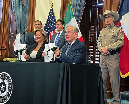 Maria Campos Galvan, governor of Mexico’s Chihuahua state, and Texas Gov. Greg Abbott display the border security agreement they signed Thursday in Austin that set in motion the lifting of Abbott’s border inspection order that has snarled freight traffic on the Texas-Mexico border.
(AP/Report for America/Acacia Coronado)