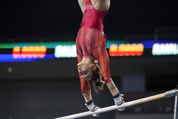 Arkansas' Kennedy Hambrick competes on the uneven bars during the NCAA women's gymnastics championships, Thursday, April 14, 2022, in Fort Worth, Texas. (AP Photo/Tony Gutierrez)