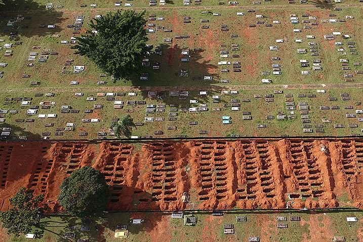 Rows of graves are freshly dug at the Campo da Esperanca cemetery in Brasilia, Brazil, in March 2021. A group of specialists including demographers, public health experts, statisticians and data scientists has found that about 15 million people worldwide died as a result of the coronavirus by the end of 2021.
(AP/Eraldo Peres)
